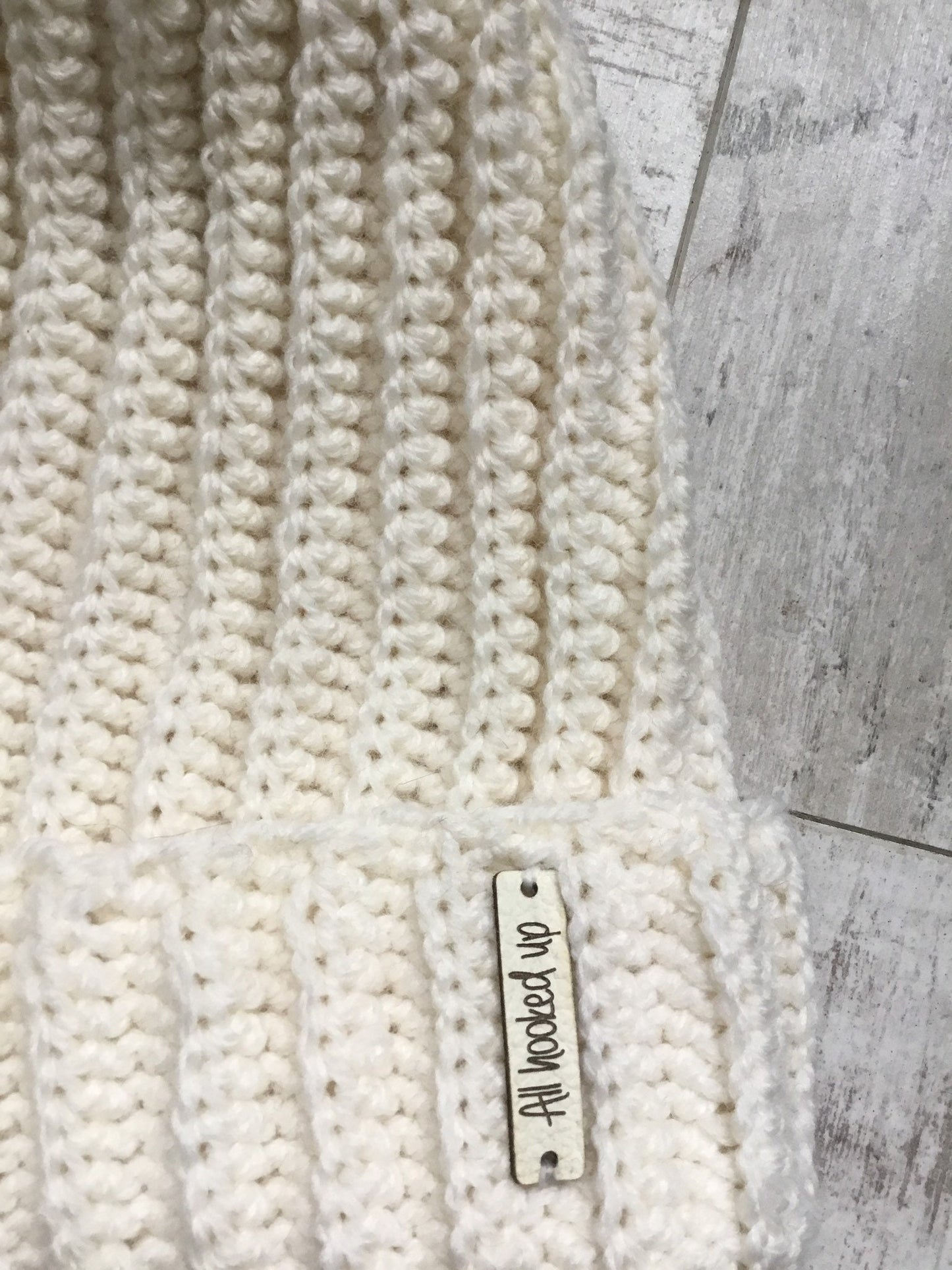 Cream Hat Black Pom Pom
