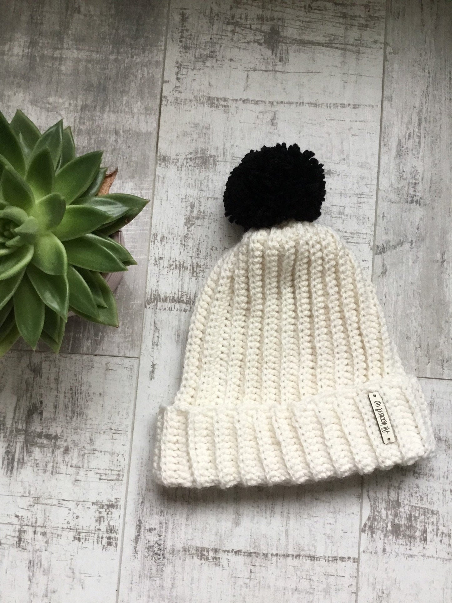 Cream Hat Black Pom Pom