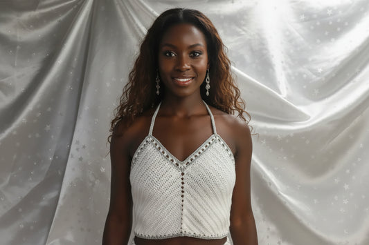 White with grey border halter neck top handmade crochet on black mannequin against white background